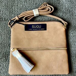 New SUGU crossbody bag.  Taupe with gold tone hardware. Vegan leather.